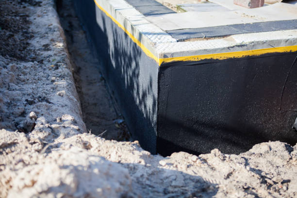 Professional Basement Waterproofing technician working in Wauseon, OH